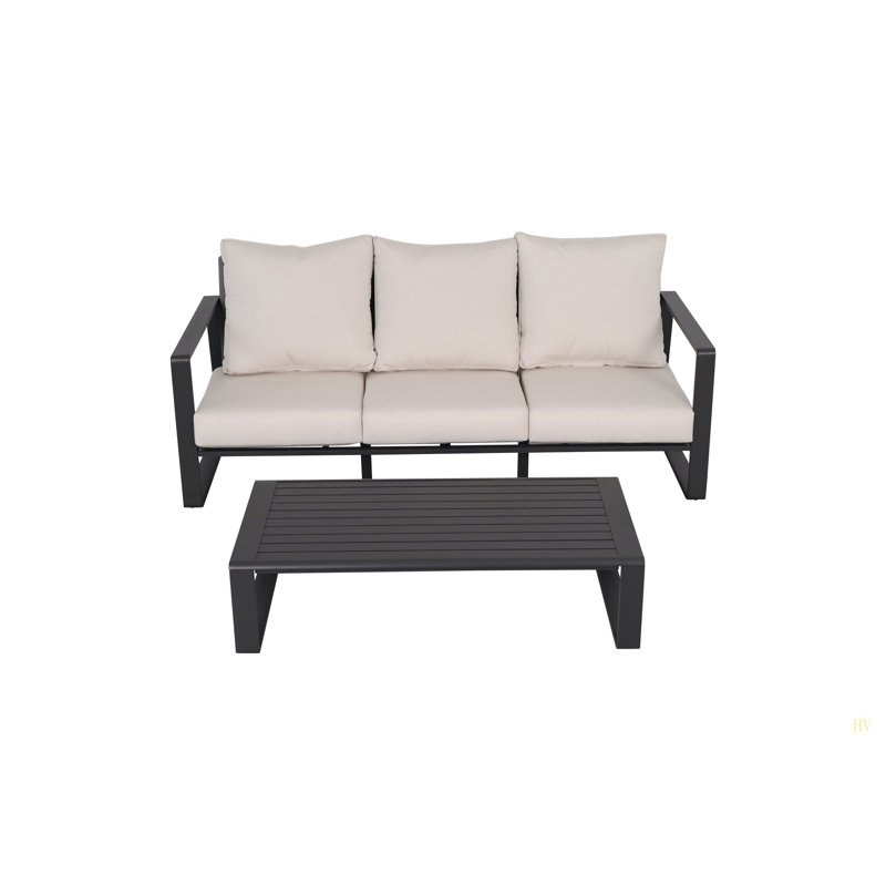 Canapé à trois places + table basse rectangulaire, coussins