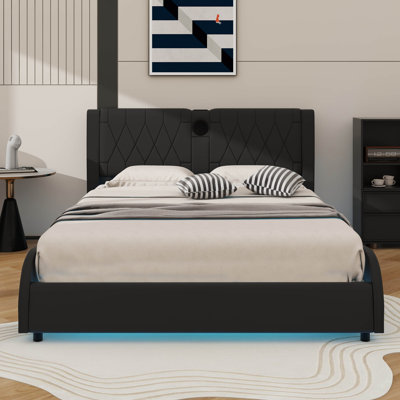 Luxurious Faux Leather Platform Bed Boasting A Reinforced Headboard, Bluetooth Audio, And RGB LED Lighting