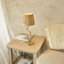 Wrangler Table light finished in Aged Brass and Raffia