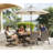 Humza 4 - Person Patio Dining Set with Round Table , Cushions Included