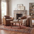 Fauteuil demi-tonneau en cuir moderne avec dossier capitonné à losanges et garniture cloutée