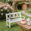 Banc de jardin en bois de style nordique avec dossier en X pour une détente en plein air et un charme rustique