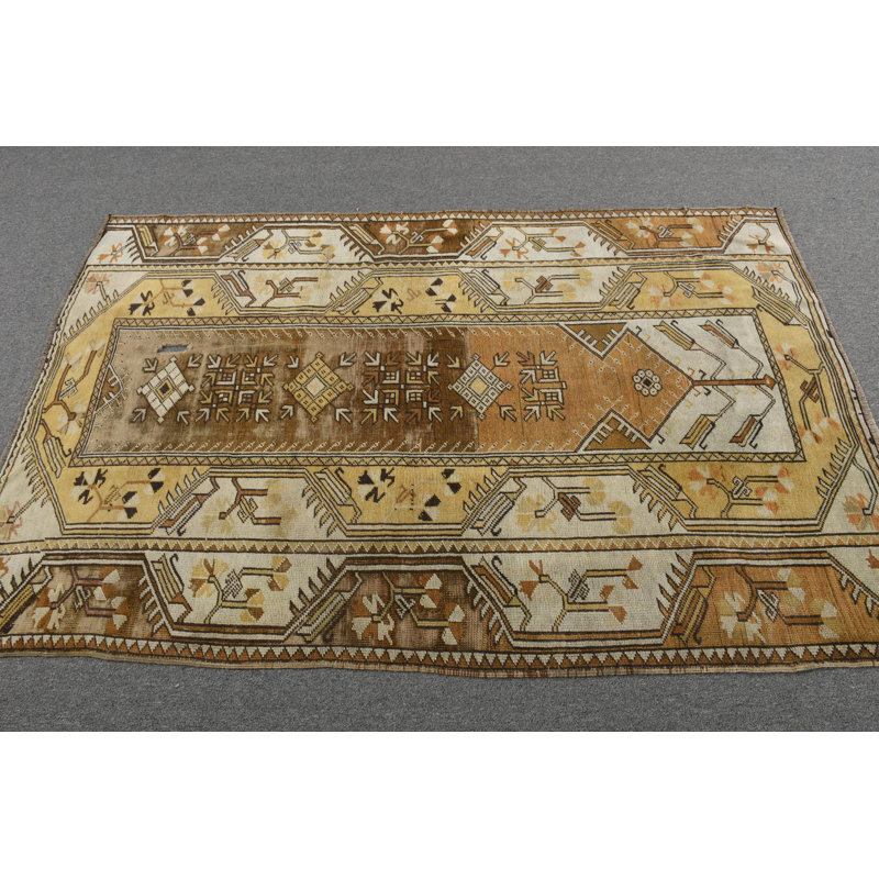 Tapis turc unique de style bohémien avec motifs géométriques dans des tons terreux uniques