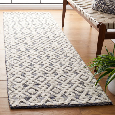Tapis ivoire / bleu marine tissé à la main Burhardt