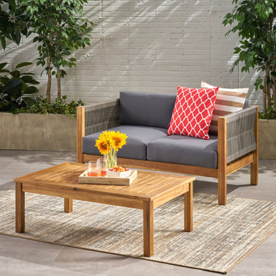 Causeuse d'extérieur 4 places avec causeuse, table basse et fauteuil club avec coussins