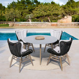 Daphnee 4 - Person Patio Dining Set with Round Table , Cushions Included