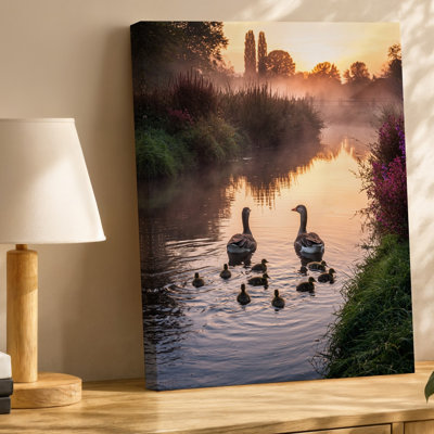 Canvas At Sunrise A Tranquil River Scene Emerges Where Two Elegant Wall Art Geese Glide Effortlessly Across The Glistening Water Their Canvas Wall Art