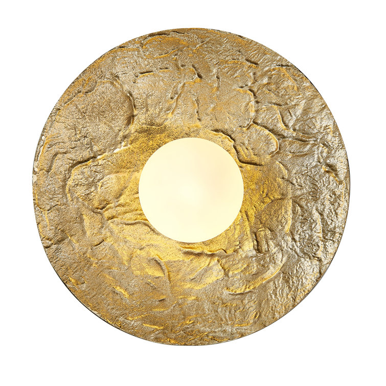 This Unique LED Wall Sconce Is In A Brass Finish. The Frame Is Made Out Of Stainless Steel, And The LED Bulb Is Integrated Into The Frame. It Also Comes With An Opal White Glass Shade. It Can Be Used In Any Rooms, Entryway, And More.