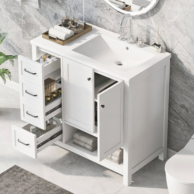 Meuble-lavabo de 36 po en bois massif avec lavabo en céramique, deux portes, deux tiroirs et une tablette ouverte pour un grand rangement