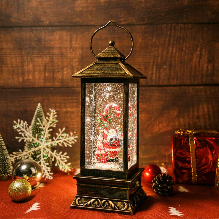 The Holiday Aisle® Christmas Musical Snow Globe Lantern Spinning