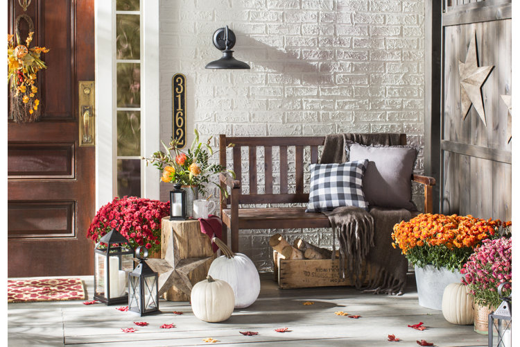 farmhouse front porch decorated for fall