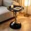 Table d'appoint ronde moderne avec base à piédestal doré, plateau en métal noir, table de bout décorative pour le salon