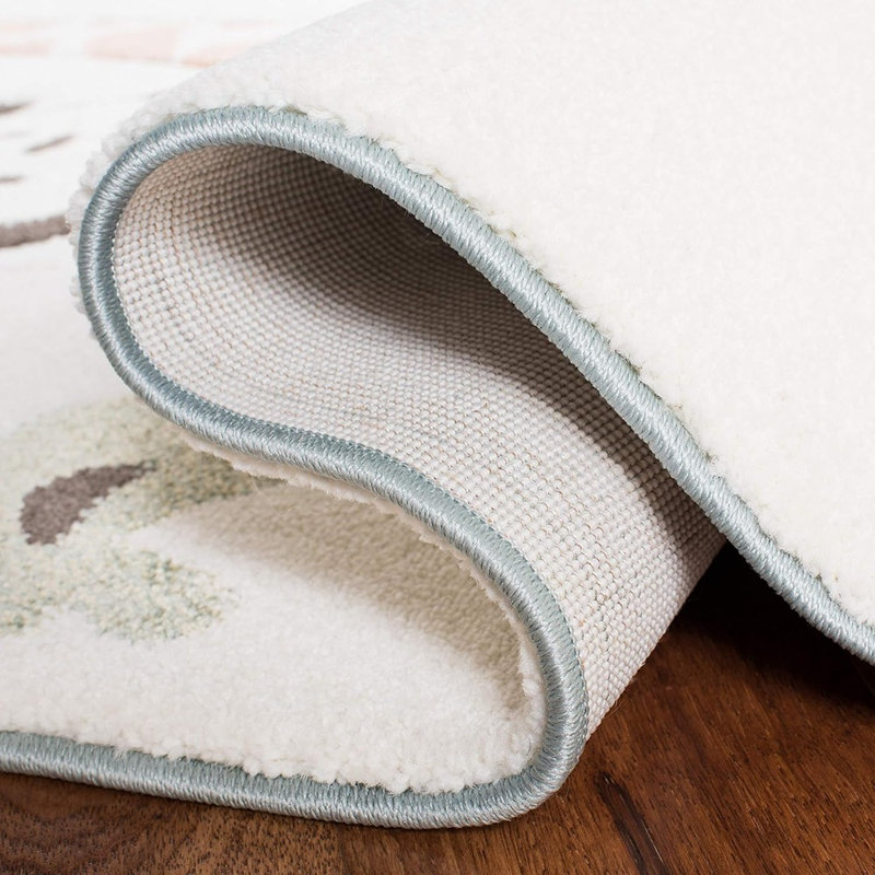 Tapis moderne ivoire à motif fantaisie, revêtement de sol intérieur doux et durable