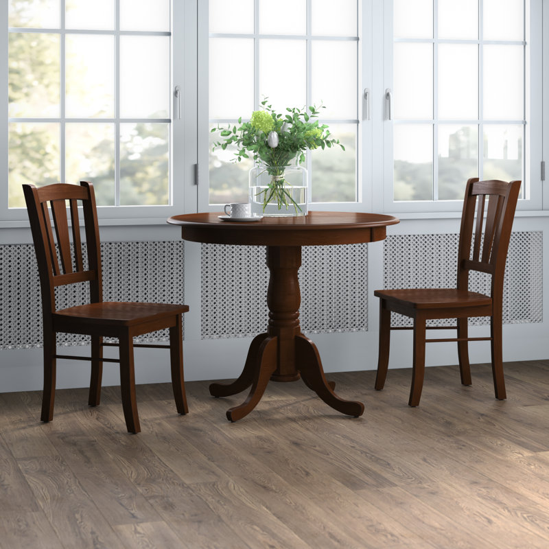 L'ensemble 3 pièces de table et chaises de cuisine comprend une table de salle à manger ronde avec piédestal et 2 chaises de salle à manger, acajou