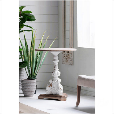 Table d'appoint ronde antique blanche avec piédestal sculpté, parfaite pour un décor classique et rétro