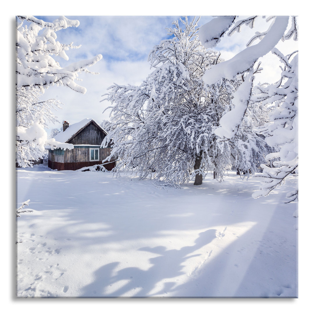 Glasbild Winterlandschaft mit Hütte