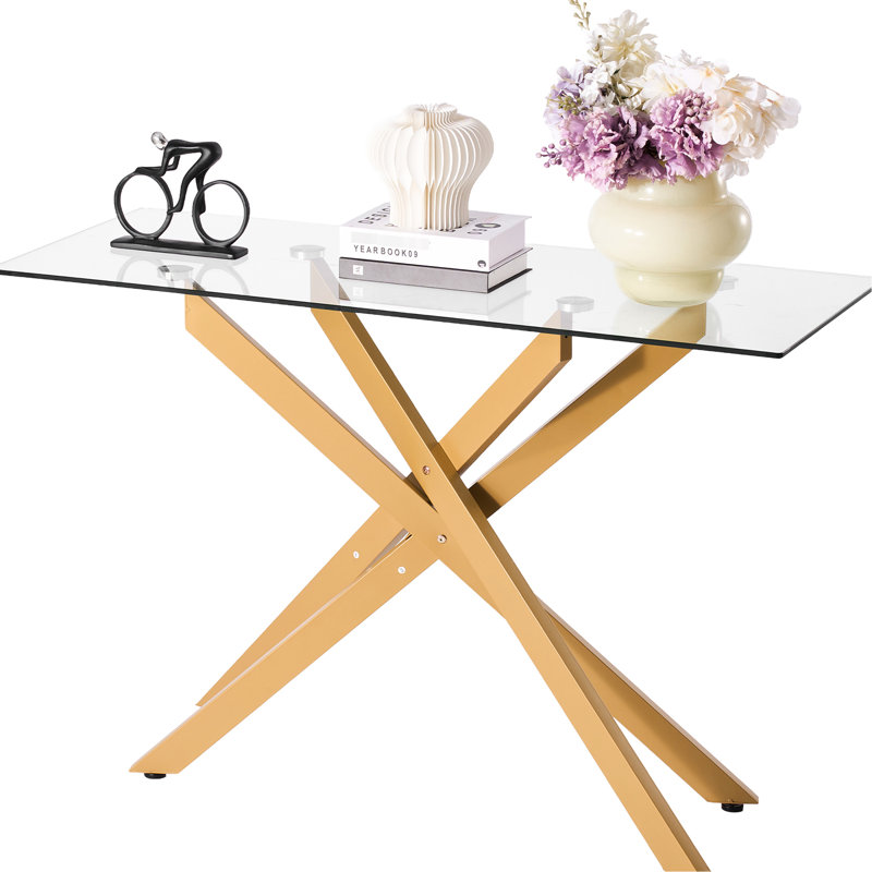 Table basse géométrique moderne avec croix en fer doré - pieds et verre trempé épais de 8 mm. Coussinets de pieds réglables, 45 po de profondeur, 18 po de largeur, 30 po de hauteur. Idéal pour le salon