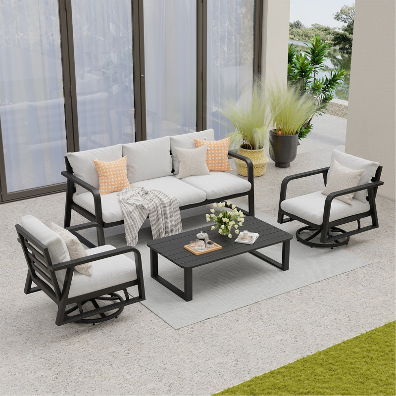 Un canapé trois places + deux chaises pivotantes + une table basse
