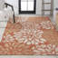 Tapis intérieur / extérieur à motif floral texturé orange / crème Zinnia-2098090143