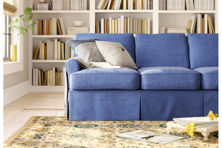 farmhouse-style living room with a soft blue sofa