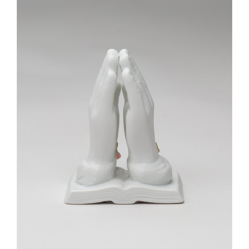 Figurine priant avec une rose