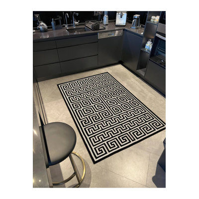 Tapis de sol noir tissé à motif géométrique moderne