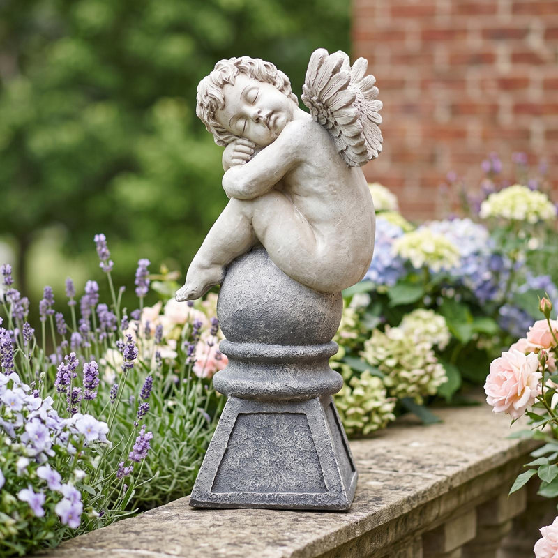 Balancing a Dream Cherub Garden Statue