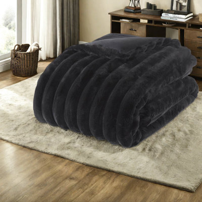 Ensemble de literie très luxueuse en fausse fourrure noire, texture douce et nervurée, confort douillet