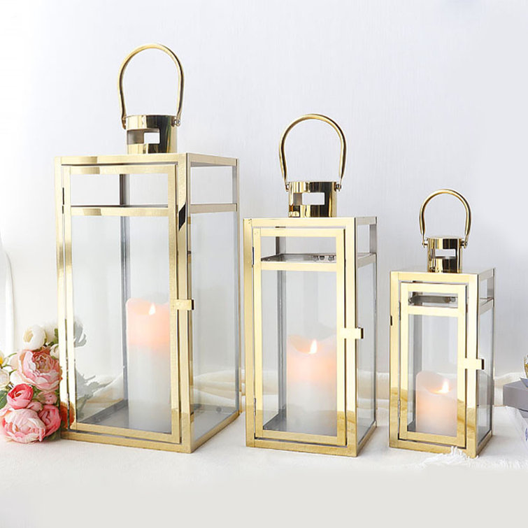 ((small dent at the top )).     Set Of 3 Stainless Steel Candle Lantern With Tempered Glass