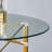 Transparent Round Tempered Glass Table with Adjustable Golden Metal Legs, Telescopic Support, Suction Cup Stability, and Foldable Space-Saving Design.