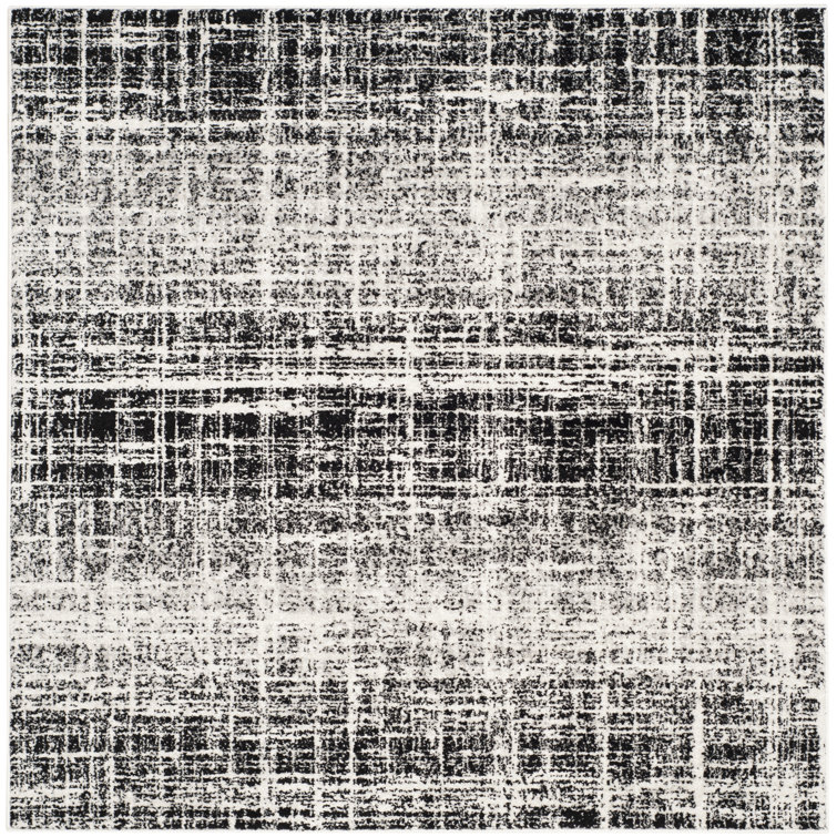 Riebe Black Area Rug