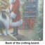 Collie and Santa Claus Glass Cutting Board