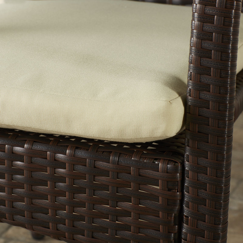 Arturas 4 - Person Wicker Patio Dining Set with Round Table , Cushions Included, Brown