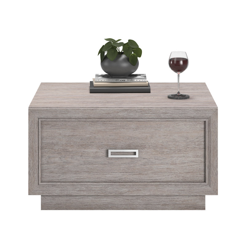 Table basse grise avec tiroir coulissant lisse et tablette ouverte, design moderne pour les salons, gris moyen compact avec un rangement spacieux, ajout élégant aux espaces, simple
