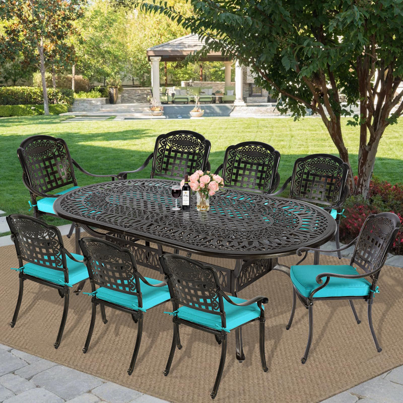 Oval 8 - Person 83.8" Long Dining Set with Cushions, Blue, 9 Pieces: Table, 8 Chairs