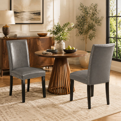 Chaise de salle à manger rembourrée avec garniture cloutée et dossier haut en similicuir LUMERA