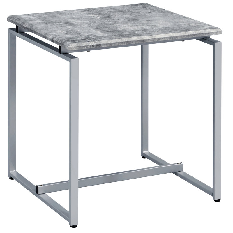 Tables d'appoint modernes grises et argentées - idéales pour le coin-détente. Surface rectangulaire en faux béton avec une base de traîneau en métal gris et une base de divertissement argentée.