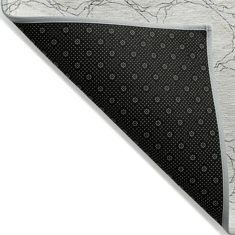 Tapis extérieur lavable à motif géométrique ivoire et noir 10 pi x 14 pi