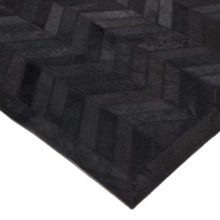 Meir Leather Chevron Area Rug in Black