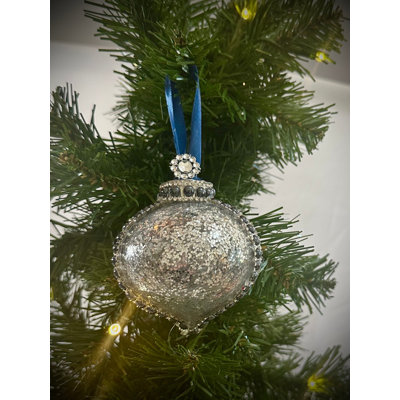 Stunning Silver Glittered Glam ornament embellished with Rhinestones and Dark Blue Pearls with a mini faux crystal topper and blue ribbon
