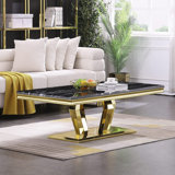 Liticia Coffee Table with Four Gold Geometric Mirror Bases and 48" Black Top