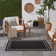 Aubreanna Abstract Machine Woven Chenille Indoor/Outdoor Area Rug in Black