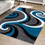 Tapis turquoise à motif abstrait Anghelina-24002568