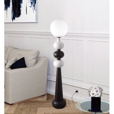 Simple and Modern Floor Lamp with Glass and Wrought Iron Elements.