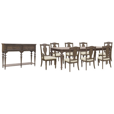 Table de salle à manger extensible avec 6 chaises à dossier en bois, 2 fauteuils et un buffet.