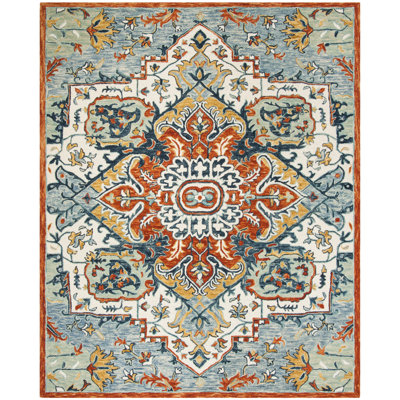Vahakn Hand Tufted Wool/Cotton Southwestern Rug in Blue/Rust