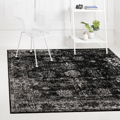 Tapis noir à motif floral Brandt