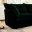 Fauteuil luxueux avec assise profonde et coussins moelleux en velours côtelé
