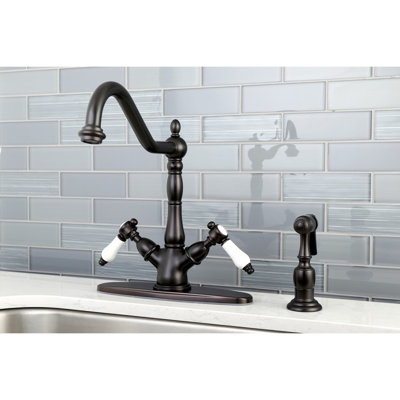 Kingston Brass Bel-Air Two-Handle 2-or-4 Hole Deck Mount Kitchen Faucet with Brass Sprayer