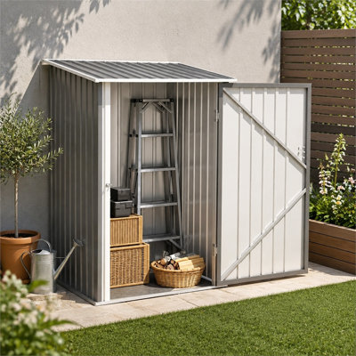 Abri de jardin gris adossé